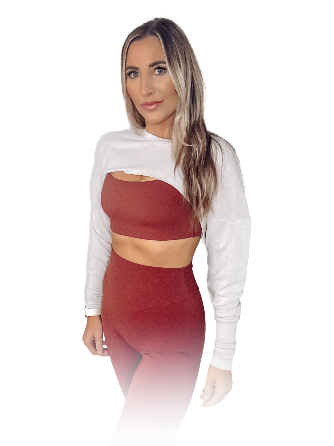 Leslieann standing in burgundy activewear against a light wall
